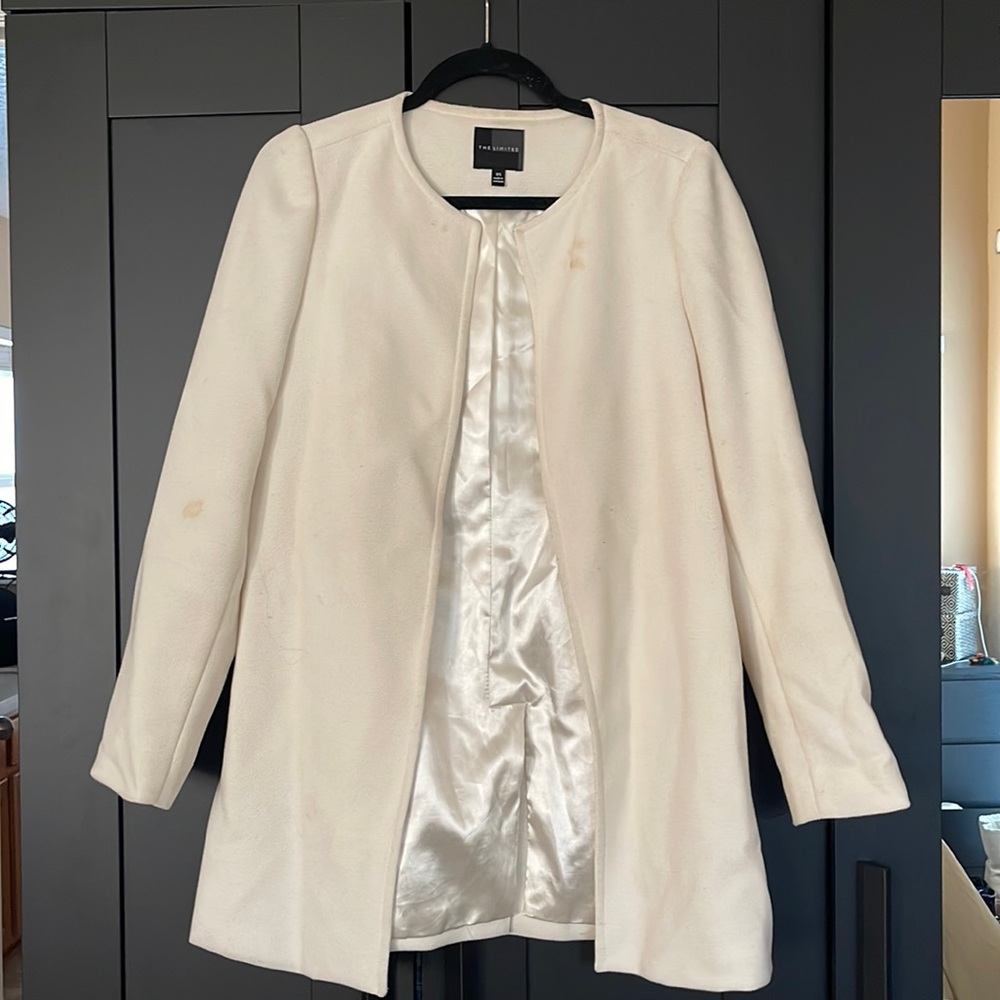 The limited size XS white coat
